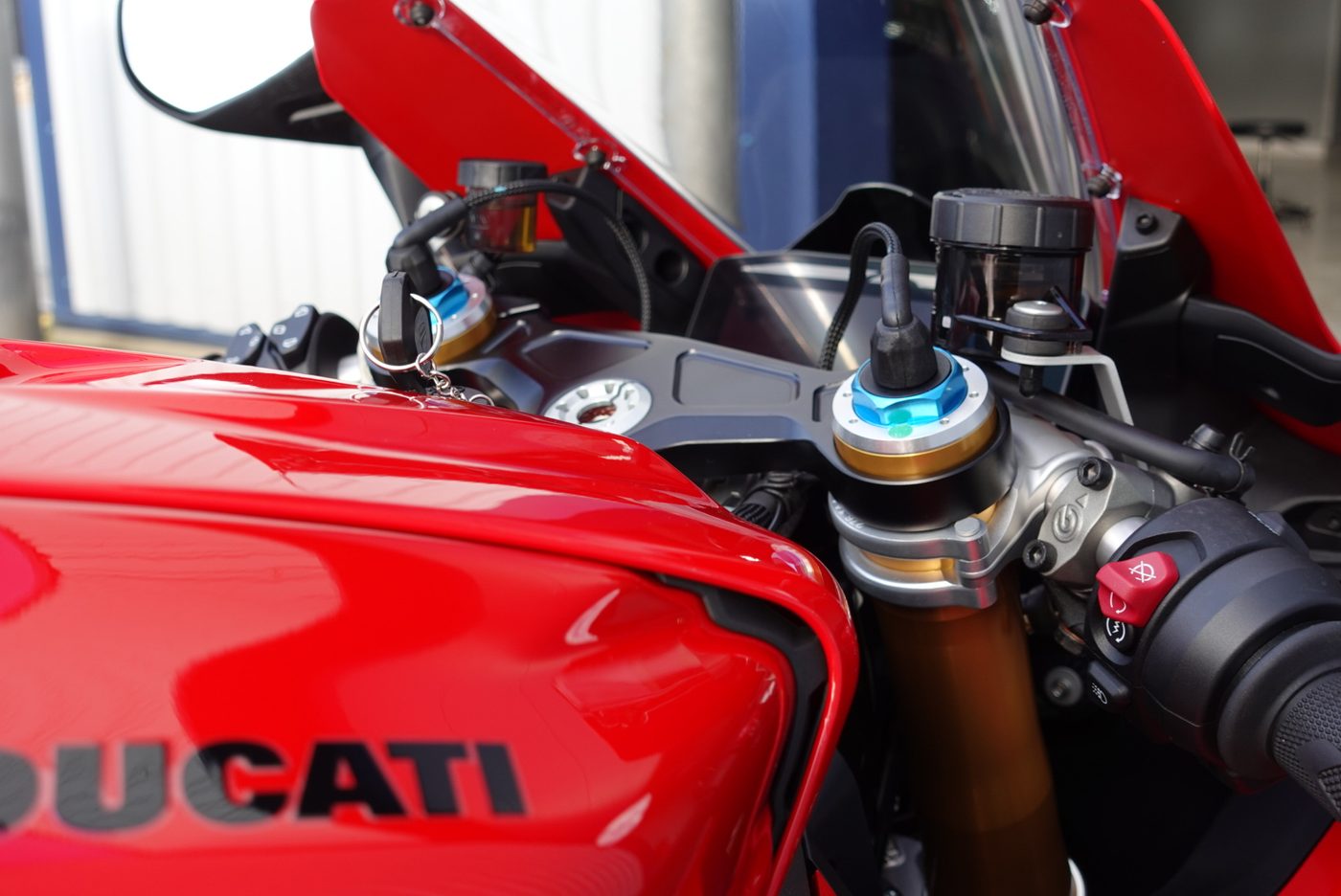 Detailed Ducati cockpit with Öhlins fork tops — the intricate areas a quick clean never reaches