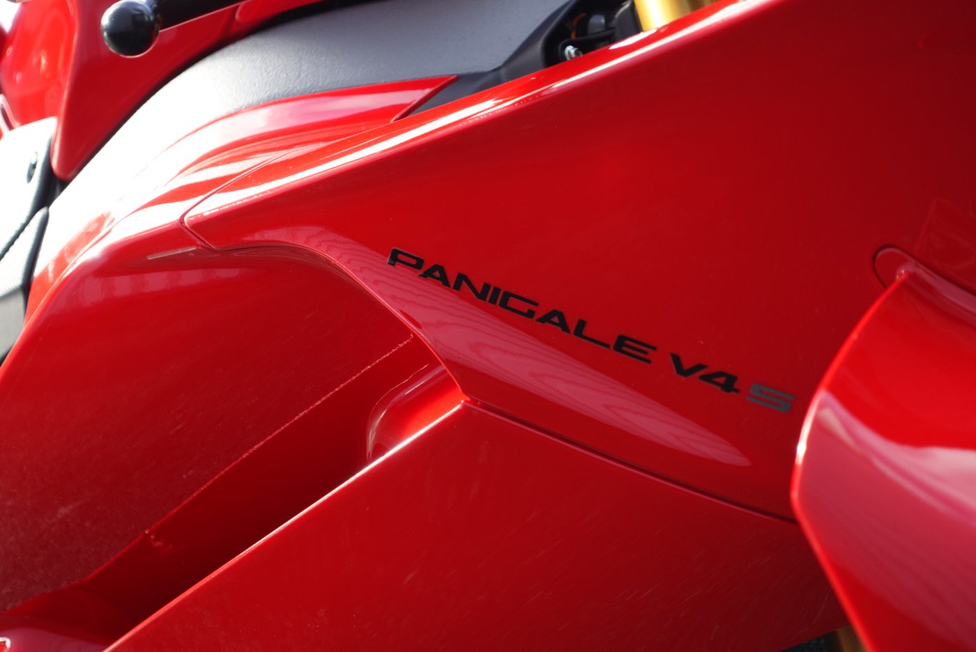 Deep gloss on a corrected Ducati Panigale V4S fairing after machine polishing